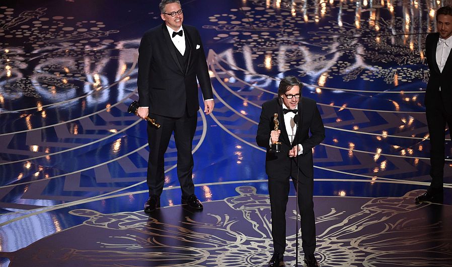 HOLLYWOOD, CA - FEBRUARY 28: Screenwriter-director Adam McKay (L) and screenwriter Charles Randolph accept the Best Adapted Screenplay award for 'The Big Short' onstage during the 88th Annual Academy Awards at the Dolby Theatre on February 28, 2016 in Hollywood, California. Kevin Winter/Getty Images/AFP == FOR NEWSPAPERS, INTERNET, TELCOS & TELEVISION USE ONLY ==