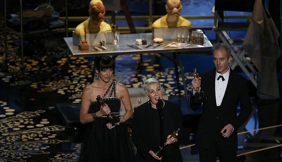 Elka Wardega (C) accepts the award for Best Makeup and Hair dressing for "Mad Max: Fury Road " with co-winners Lesley Vanderwalt (L) and Damian Martin at the 88th Academy Awards in Hollywood, California February 28, 2016. REUTERS/Mario Anzuoni