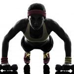 21975859 - one woman exercising fitness workout push ups in silhouette on white background