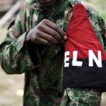 A rebel of Colombia's Marxist National Liberation Army (ELN) shows his armband while posing for a photograph, in the northwestern jungles, Colombia August 31, 2017. Picture taken August 31, 2017. REUTERS/Federico Rios
