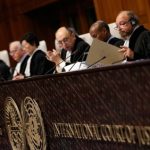 President of the International Court of Justice Ronny Abraham (2nd R) looks at a document during the court case of the border dispute between Costa Rica and Nicaragua at the International Court of Justice in the Hague, the Netherlands on December 16, 2015.
A UN court on December 16 ruled Nicaragua had violated Costa Rica's sovereignty in a long-standing row over disputed territory on the San Juan river which has soured ties between the two neighbours. / AFP / ANP / Bas Czerwinski / Netherlands OUT