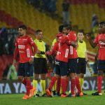 Jugadores del DIM celebran Gol de Cano ante Millonarios